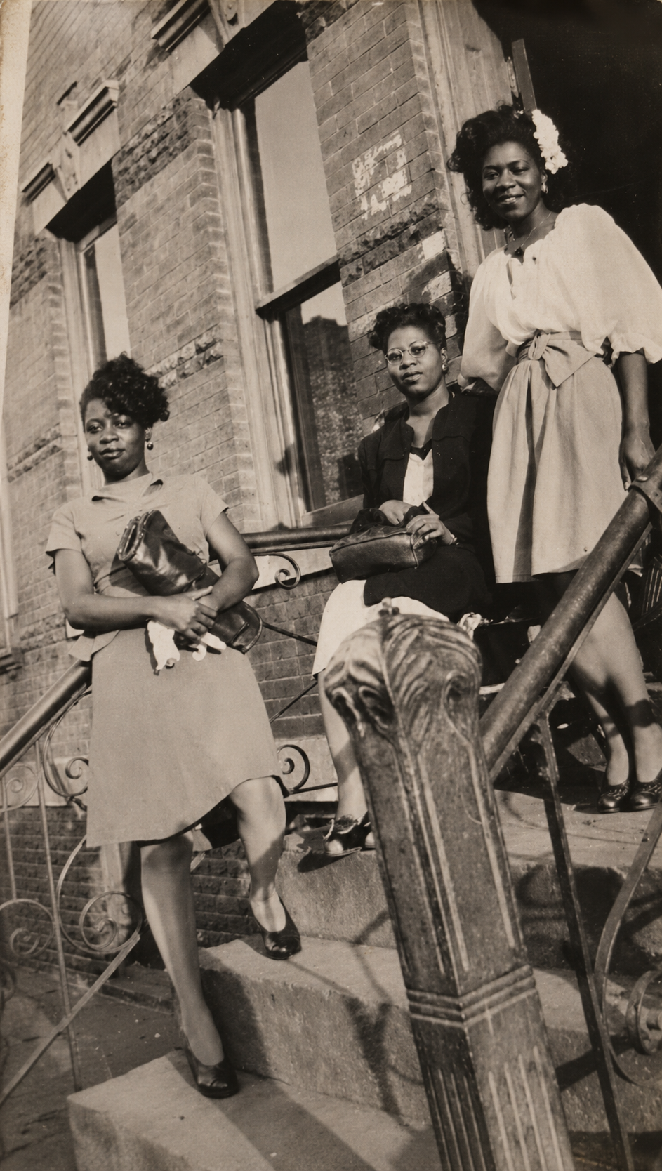 Vera Lee Battle with family, standing on a brick stoop.