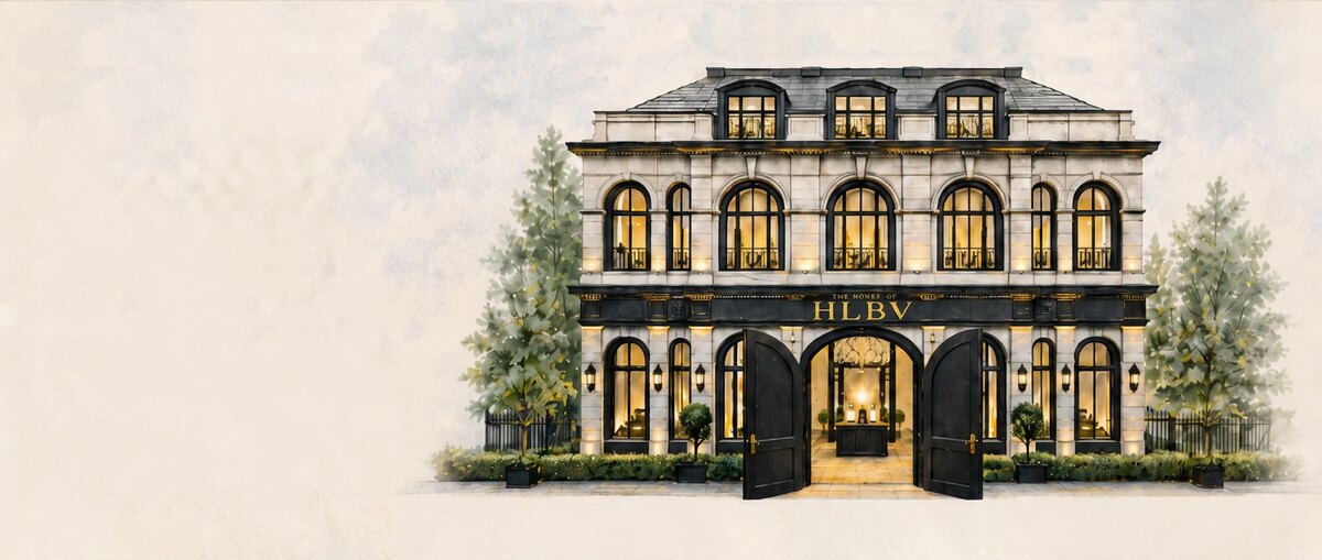The House of HLBV — a classical storefront, warm light within.